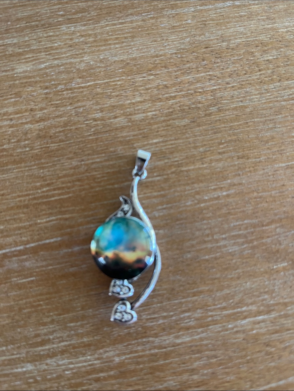 Silver Pendant Necklace with Iridescent Blue-Green Stone and Heart Accents
